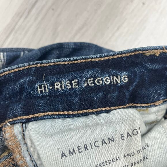 American Eagle Next Level Stretch Hi-Rise Dark Wash Button Distressed Jegging 4 - Picture 6 of 11